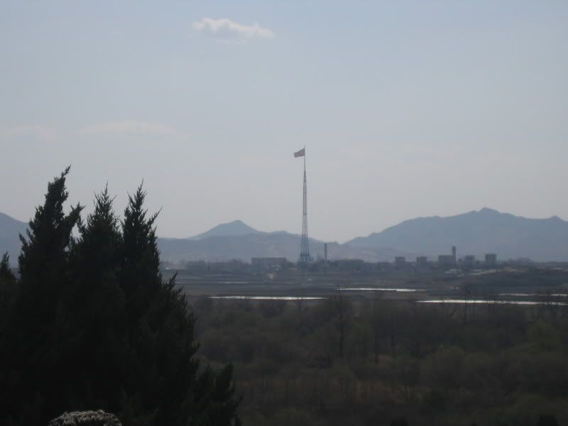 north korean people starving. North Korean flag over their
